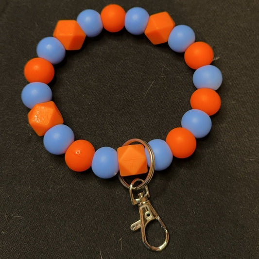 Orange, blue key wristlet